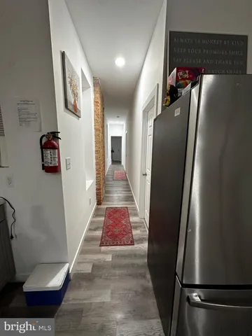 a living room with furniture rug and a table