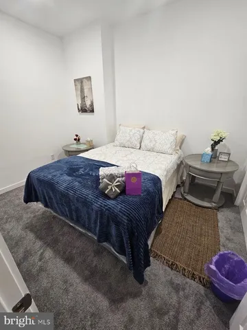 a view of a patio with a table and chairs