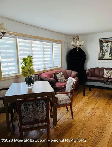 a bedroom with two beds and painting on the wall