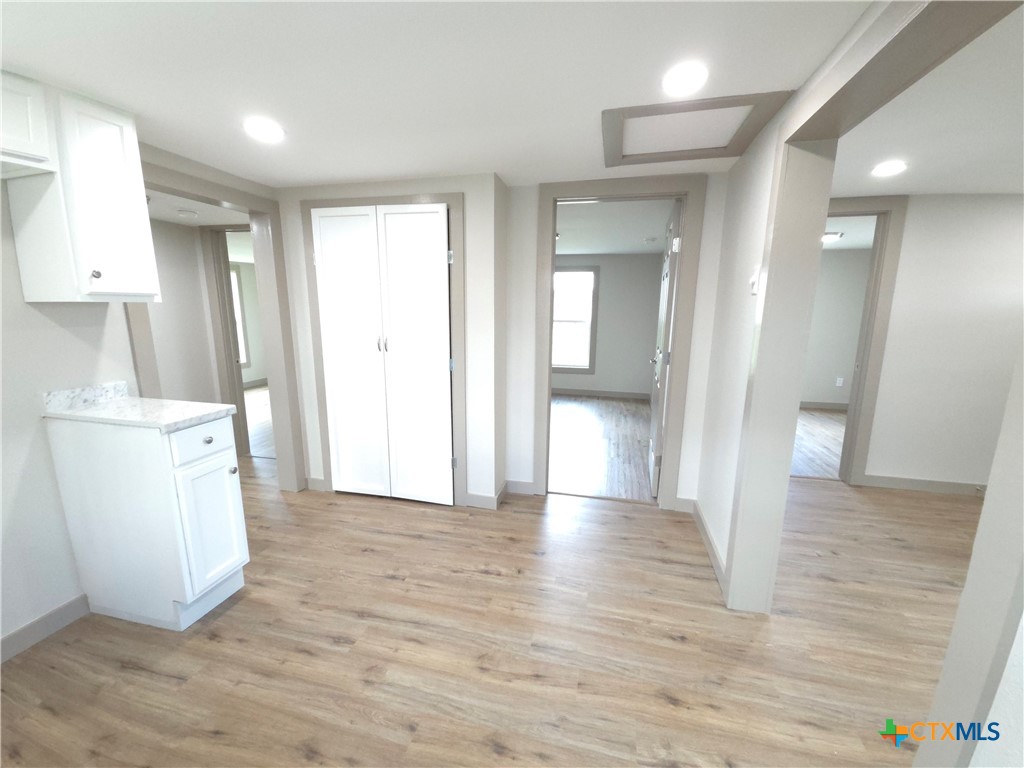 2605 Plainview Street Victoria, TX 77901 - Photo 11 of 16 a view of a kitchen with refrigerator and wooden floor