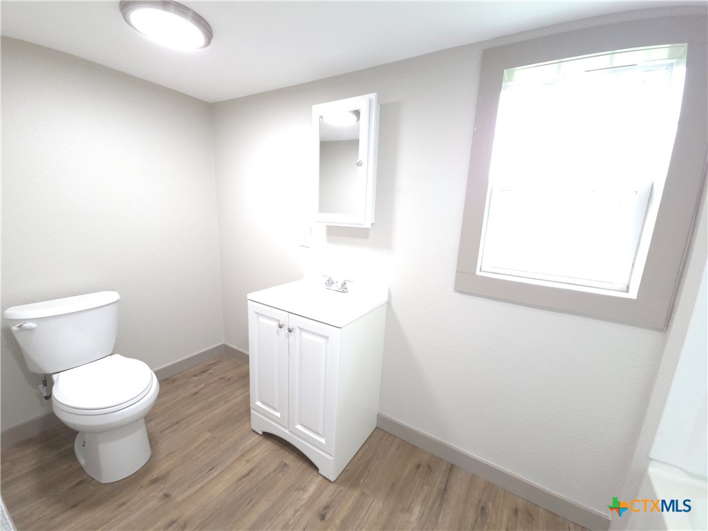 2605 Plainview Street Victoria, TX 77901 - Photo 12 of 16 a bathroom with a toilet sink and a window