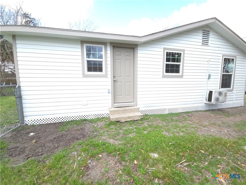 2605 Plainview Street Victoria, TX 77901 - Photo 14 of 16 a front view of a house with a yard