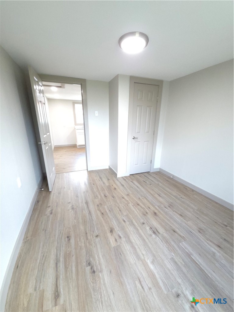 2605 Plainview Street Victoria, TX 77901 - Photo 7 of 16 a view of wooden floor and windows in a room