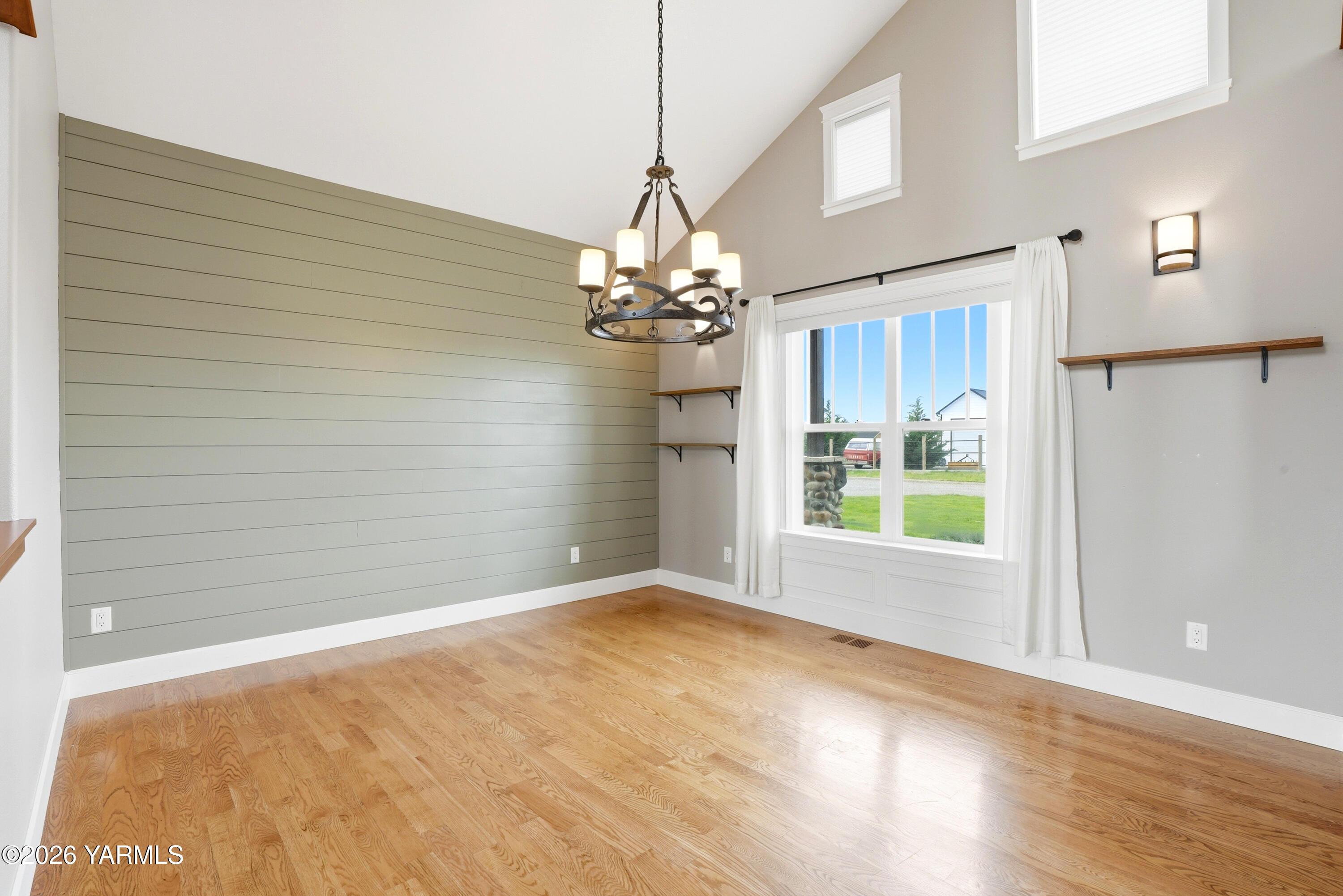 230 Albro Road Sunnyside, WA 98944 - Photo 15 of 46 a view of a room with a chandelier and wooden floor