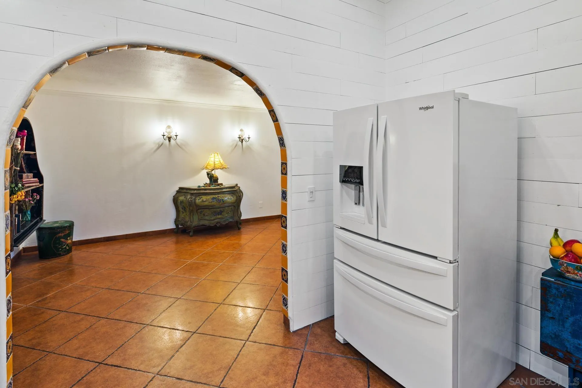 9475 Wharton Road Santee, CA 92071 - Photo 18 of 62 a hallway with a white stove top oven and a dishwasher with wooden floor