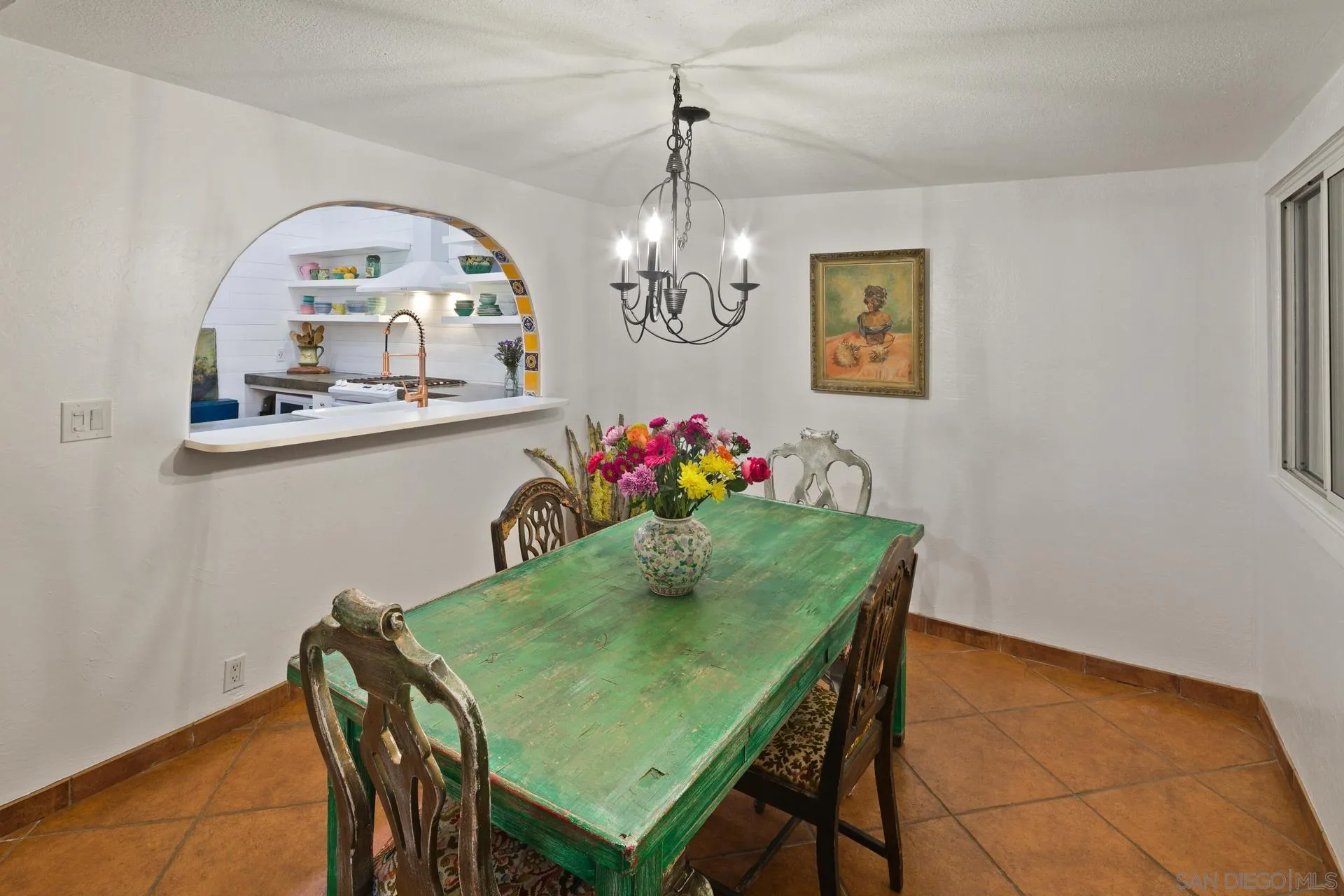 9475 Wharton Road Santee, CA 92071 - Photo 23 of 62 a view of a dining room with furniture and a chandelier