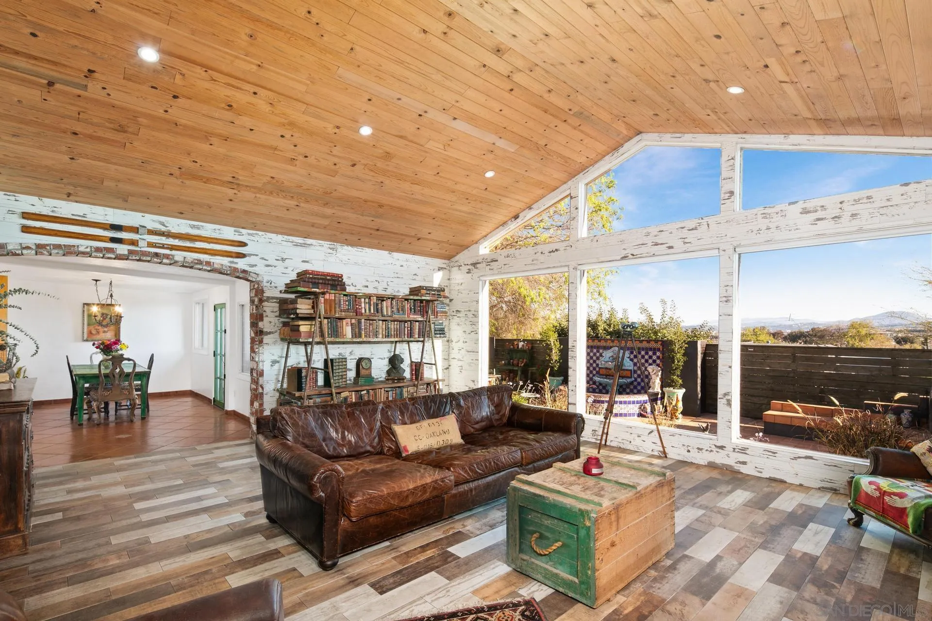 9475 Wharton Road Santee, CA 92071 - Photo 26 of 62 a living room with furniture a rug and a floor to ceiling window