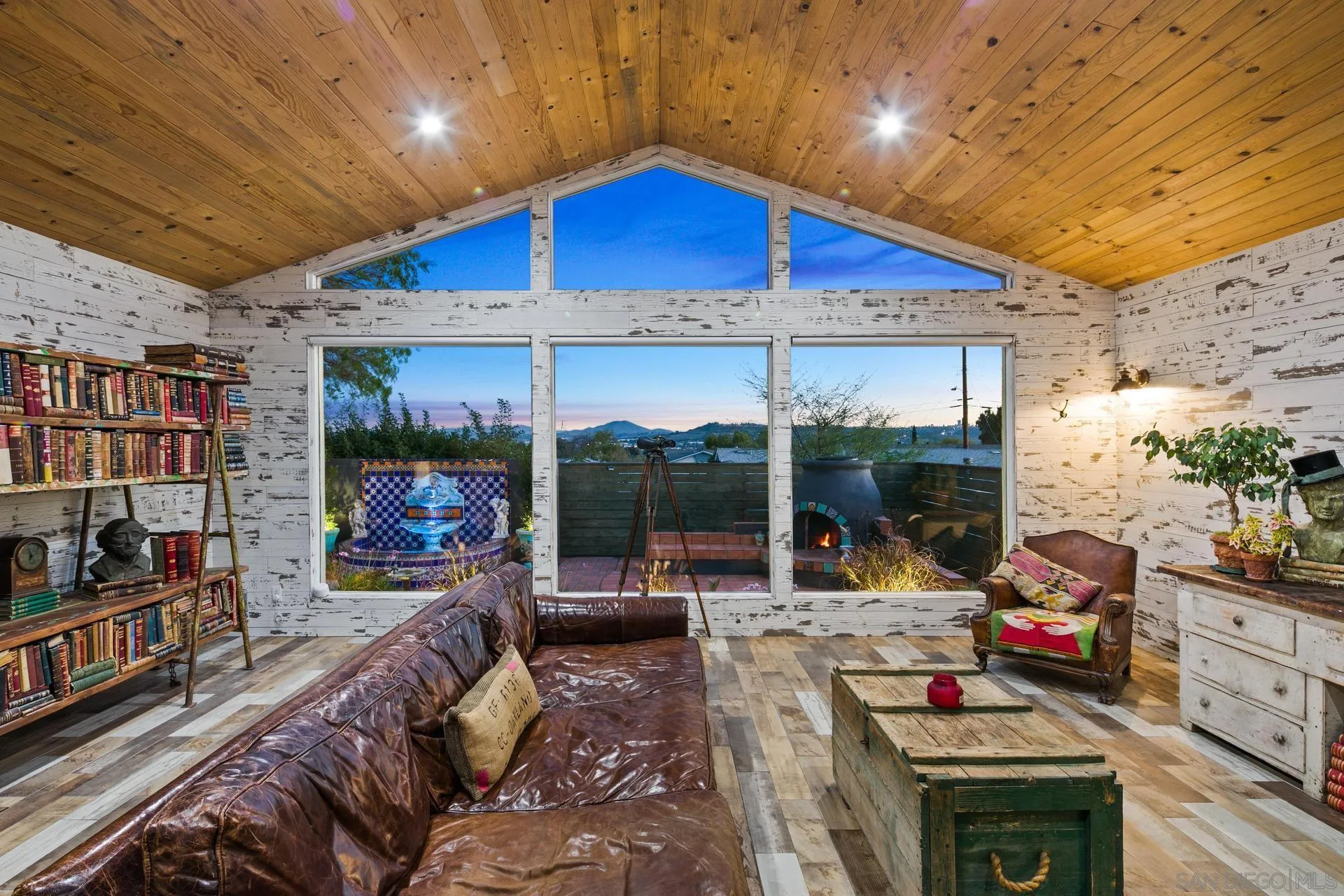 9475 Wharton Road Santee, CA 92071 - Photo 28 of 62 a living room with furniture a flat screen tv and a floor to ceiling window