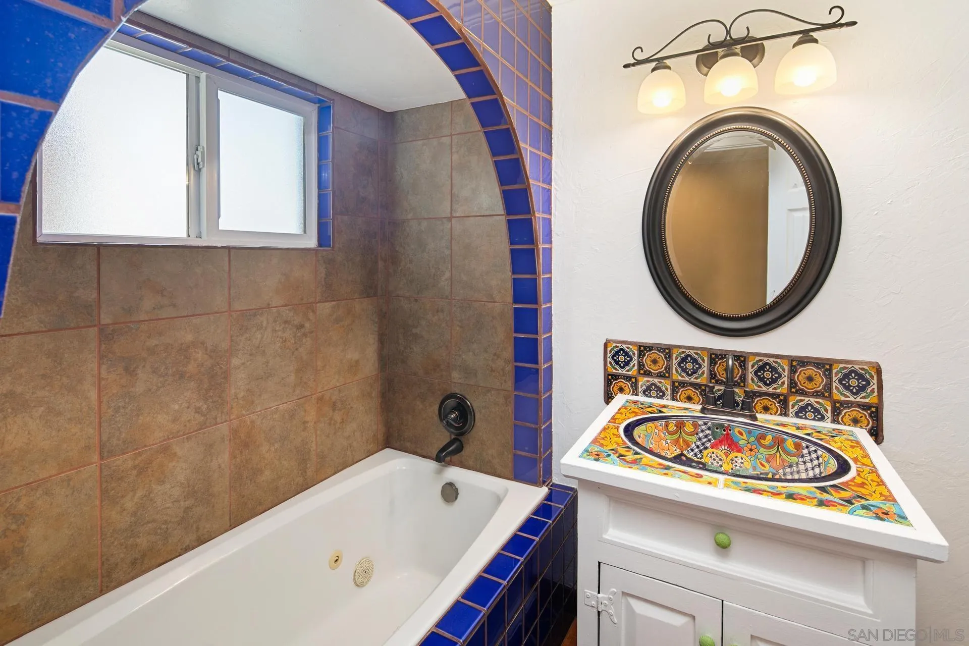 9475 Wharton Road Santee, CA 92071 - Photo 35 of 62 a bathroom with a sink a mirror and a bathtub