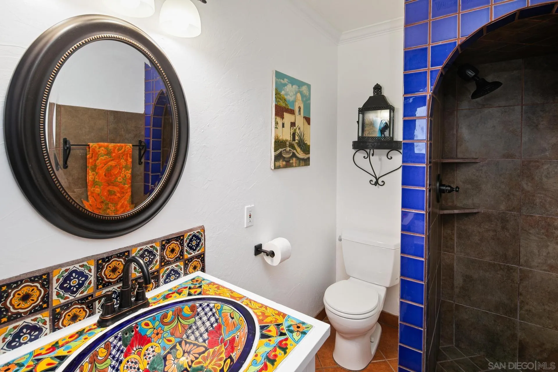 9475 Wharton Road Santee, CA 92071 - Photo 36 of 62 a bathroom with a toilet a sink and a mirror