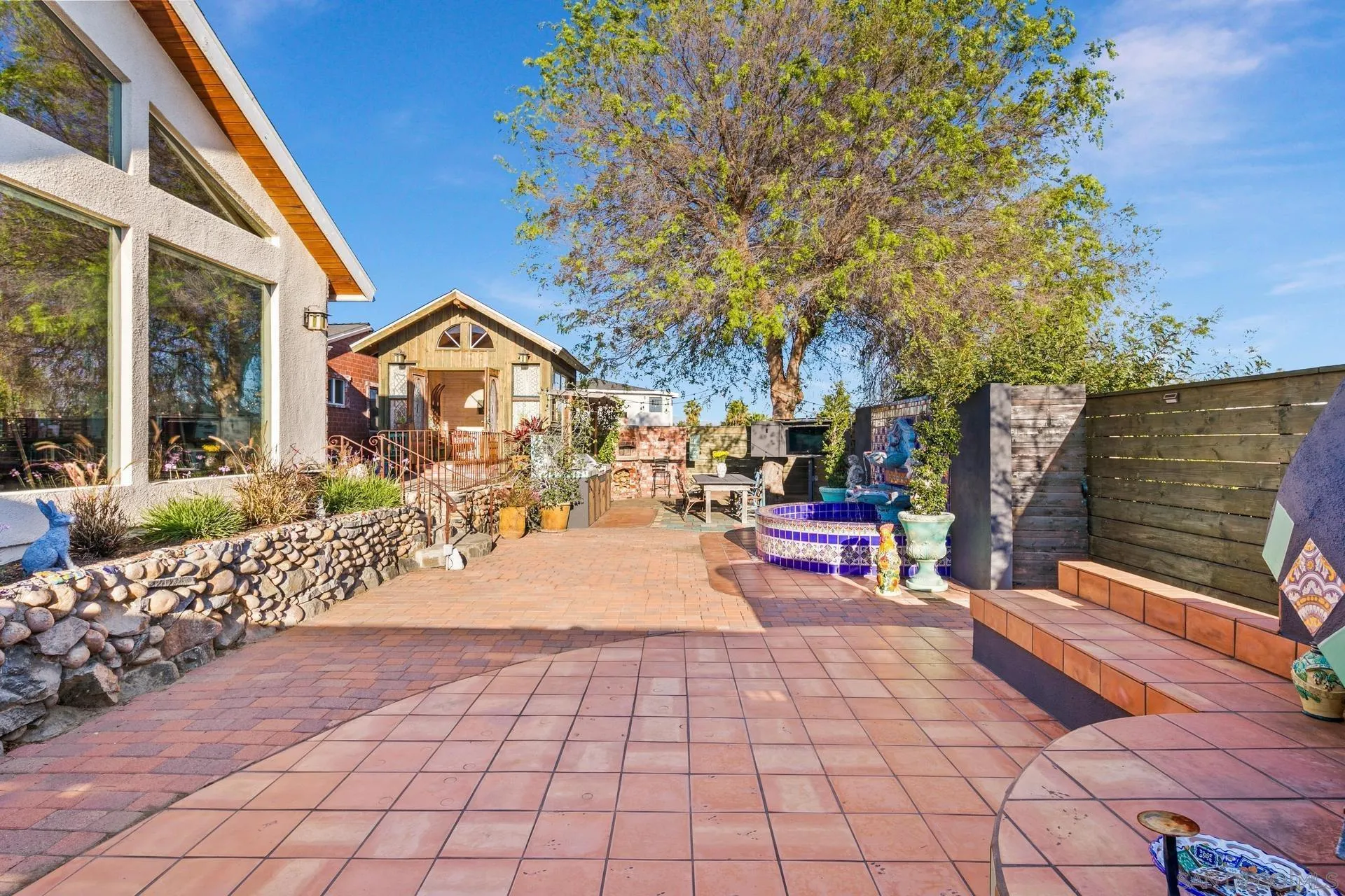 9475 Wharton Road Santee, CA 92071 - Photo 53 of 62 a wooden bench sitting in front of a building