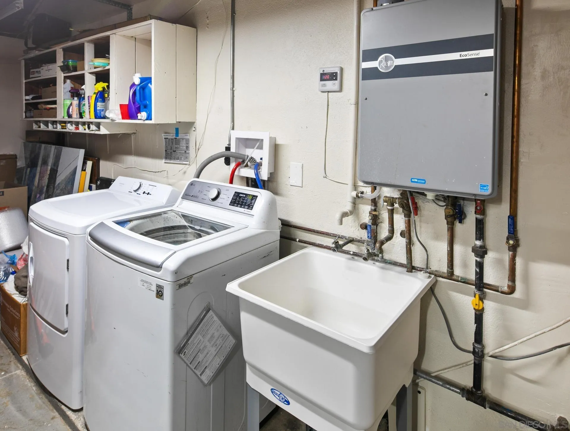 9475 Wharton Road Santee, CA 92071 - Photo 60 of 62 a utility room with dryer washer and a sink