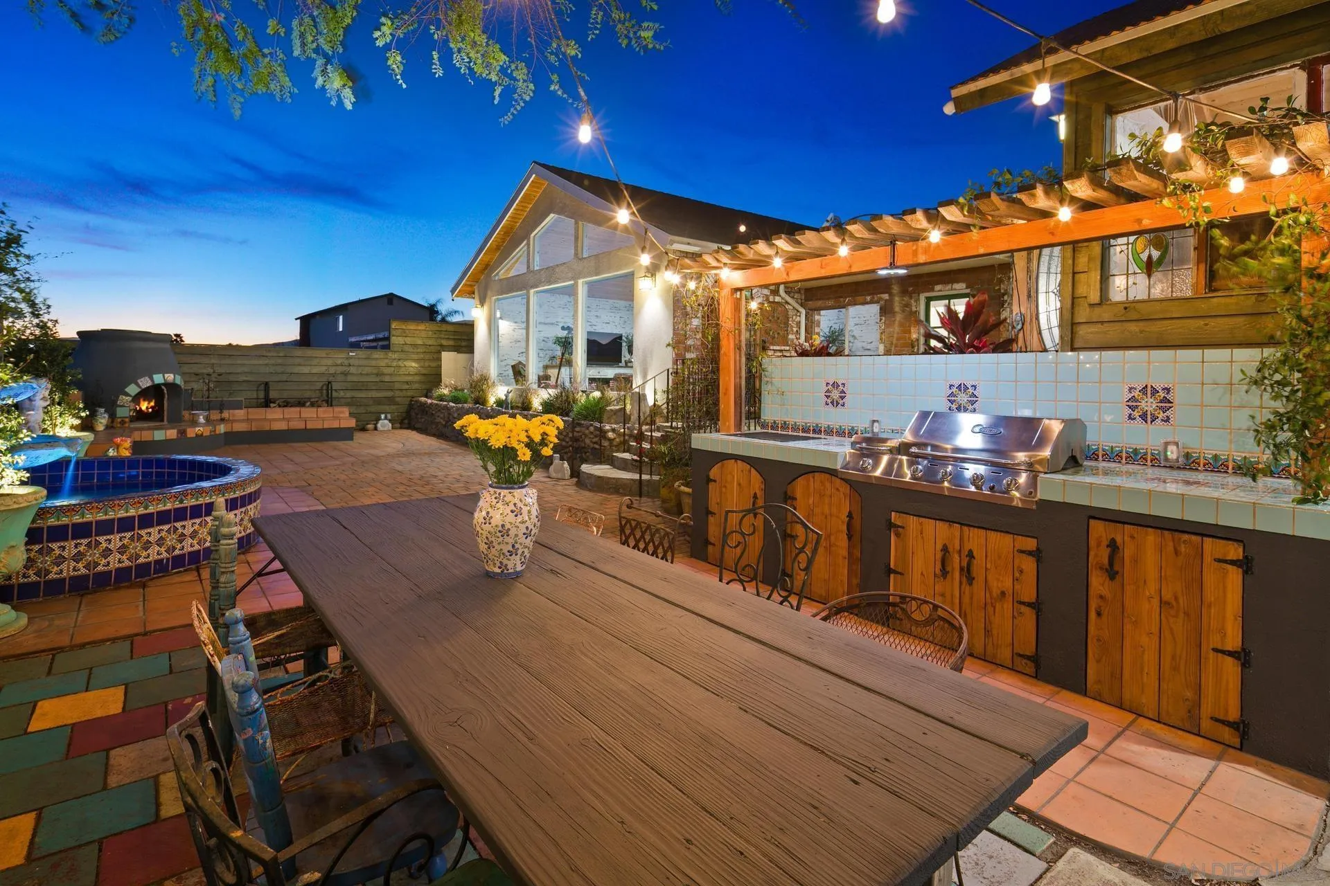 9475 Wharton Road Santee, CA 92071 - Photo 10 of 62 a view of a patio with couches table and chairs with wooden floor