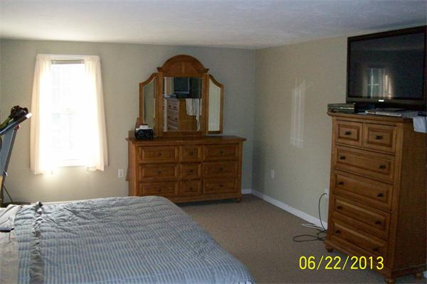 139 Colburn Road Charlton, MA 01507 - Photo 15 of 30 a bedroom with a bed and furniture