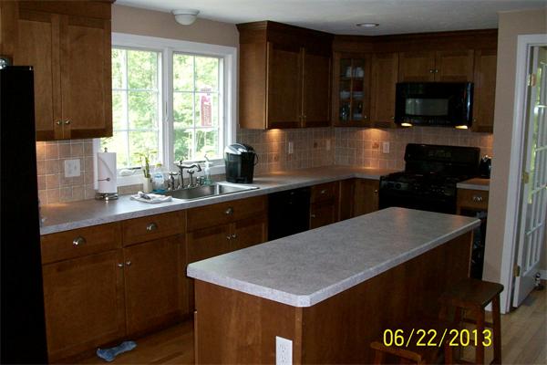 139 Colburn Road Charlton, MA 01507 - Photo 6 of 30 a kitchen with a sink a stove and microwave