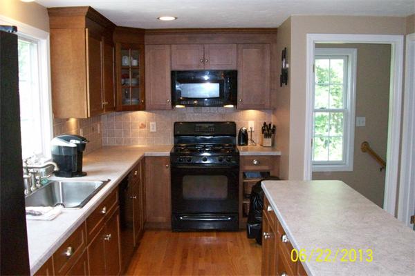 139 Colburn Road Charlton, MA 01507 - Photo 8 of 30 a kitchen with a sink stove and microwave