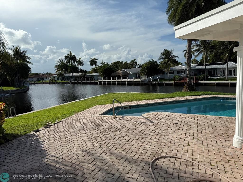 5251 Northeast 29th Avenue Fort Lauderdale, FL 33308 - Photo 1 of 6 a view of a swimming pool with a lake
