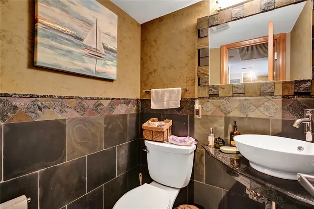 a bedroom with furniture and a large window