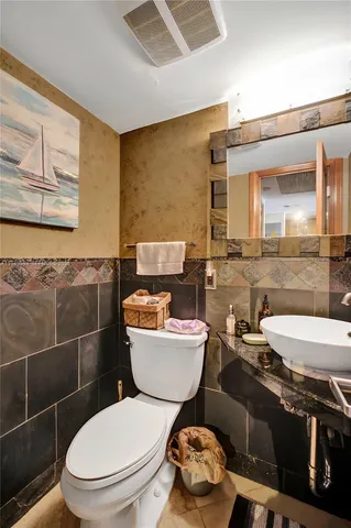 a bedroom with a bed and cabinets