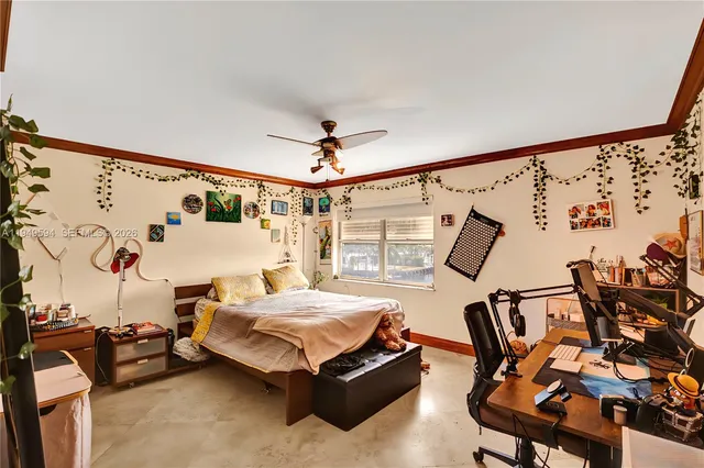 a bedroom with furniture a ceiling fan and a window