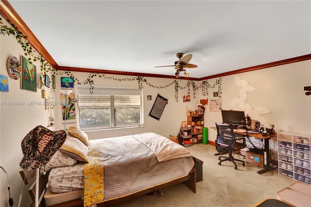 a bathroom with a granite countertop sink mirror vanity and toilet