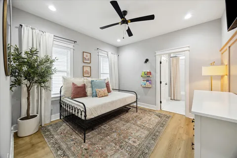 a bathroom with a sink mirror toilet and bathtub