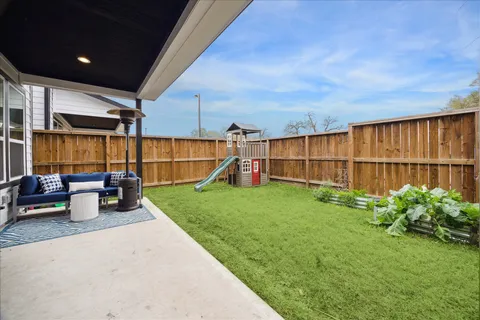 a view of a backyard with sitting area and tub