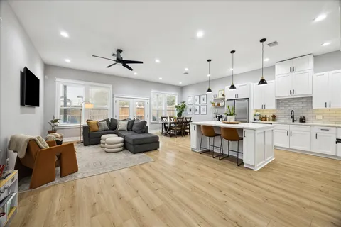 a front view of a house with patio and garden