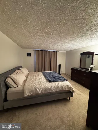 a view of a livingroom with furniture and storage
