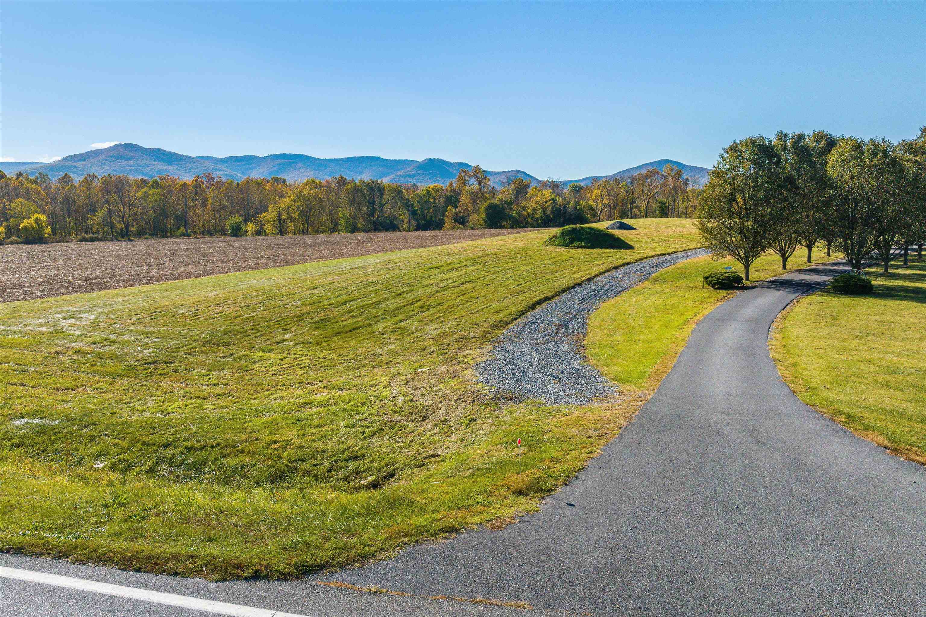 Tbd Lot 4 Tbd Road Elkton, VA 22827 - Photo 12 of 26 a view of a swimming pool with mountains and a houses with a lake view