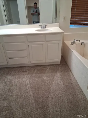 a bathroom with a sink and a bathtub