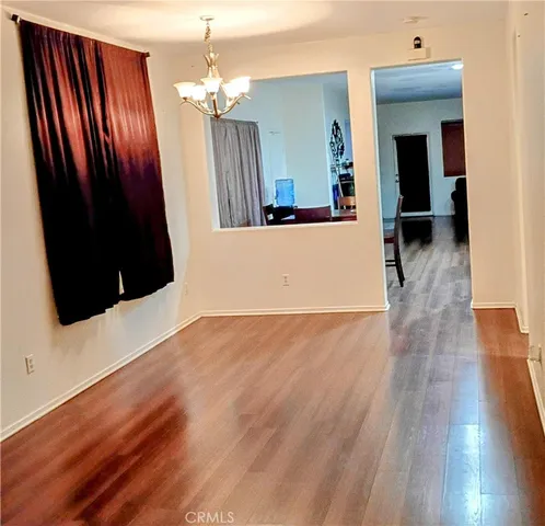 wooden floor in a hall with an entryway