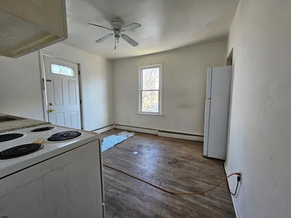 a kitchen with a sink cabinets and window
