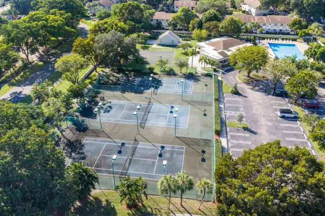 an aerial view of a house with a yard and garden