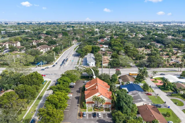 an aerial view of residential houses and outdoor space
