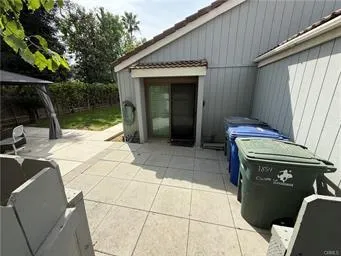 a view of backyard with swimming pool