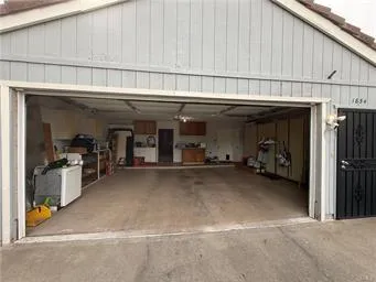 a backyard of a house with garage