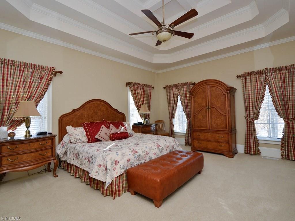 8301 Linville Oaks Drive Oak Ridge, NC 27310 - Photo 12 of 29 Spacious peaceful master suit with access to sunroom.