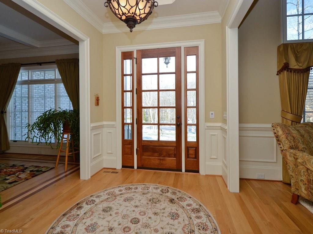 8301 Linville Oaks Drive Oak Ridge, NC 27310 - Photo 3 of 29 Bright opening at front door with sidelights. Opens to formal rooms.