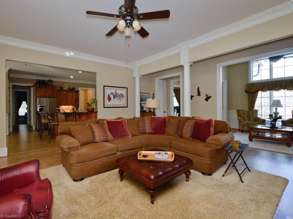8301 Linville Oaks Drive Oak Ridge, NC 27310 - Photo 7 of 29 Den opens to kitchen, foyer and living room.
