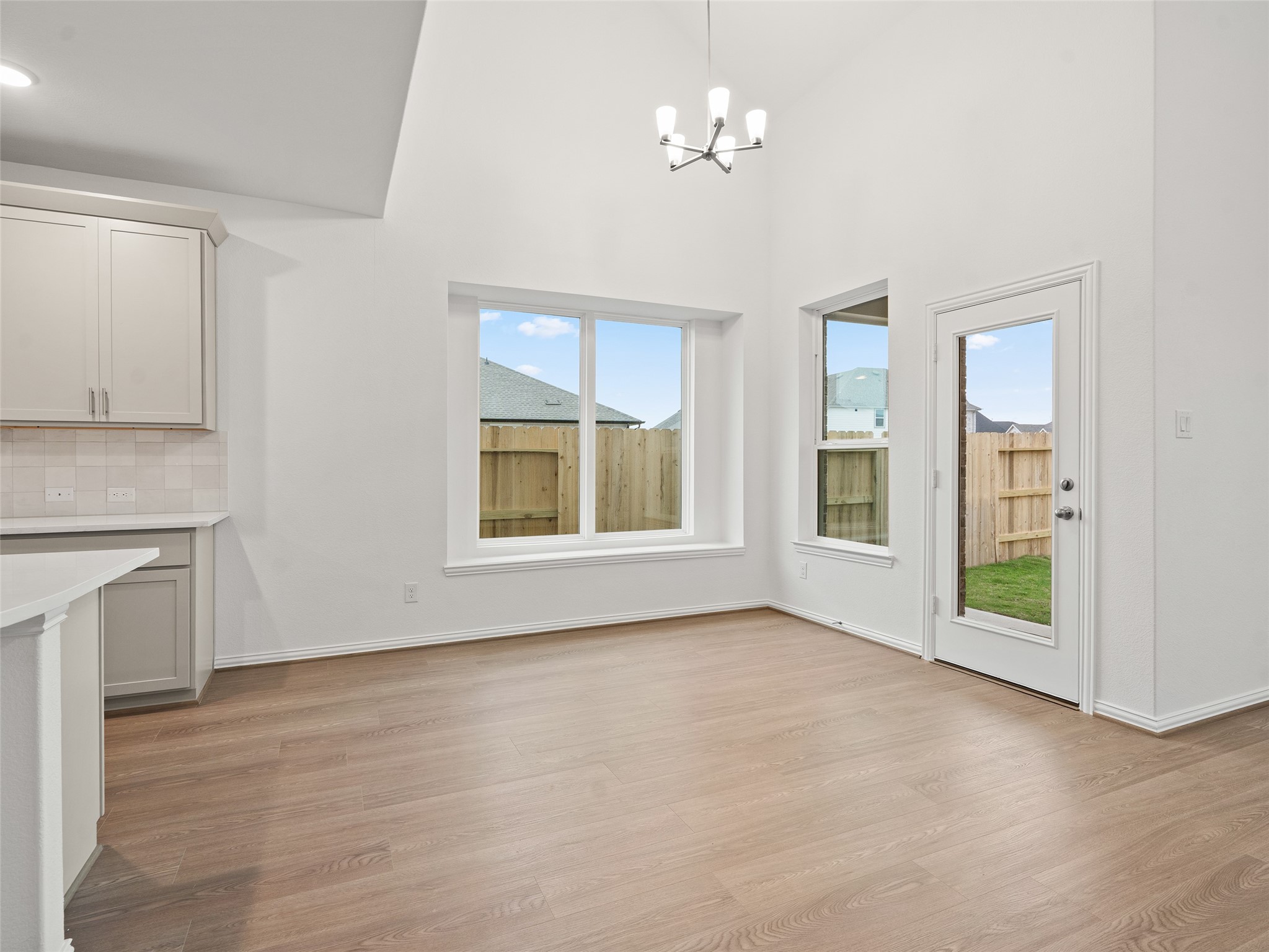 410 Strm Bnd Way Rosenberg, TX 77471 - Photo 13 of 39 a view of empty room with a fireplace and wooden floor
