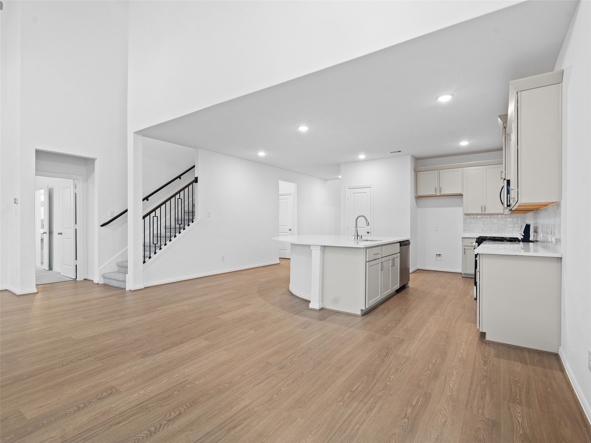 410 Strm Bnd Way Rosenberg, TX 77471 - Photo 14 of 39 a view of kitchen with wooden floor and electronic appliances