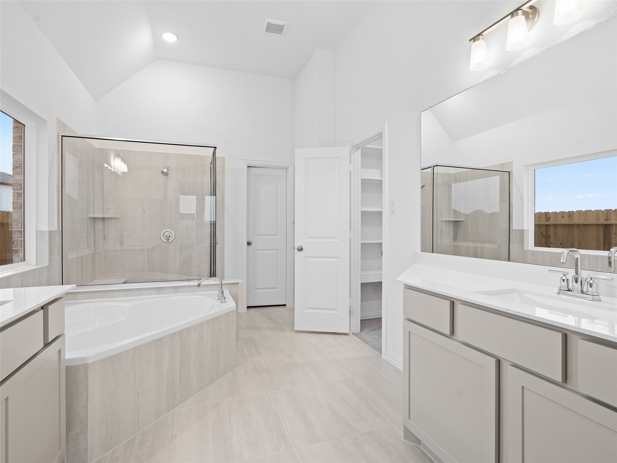 410 Strm Bnd Way Rosenberg, TX 77471 - Photo 21 of 39 a bathroom with a bathtub shower sink and mirror