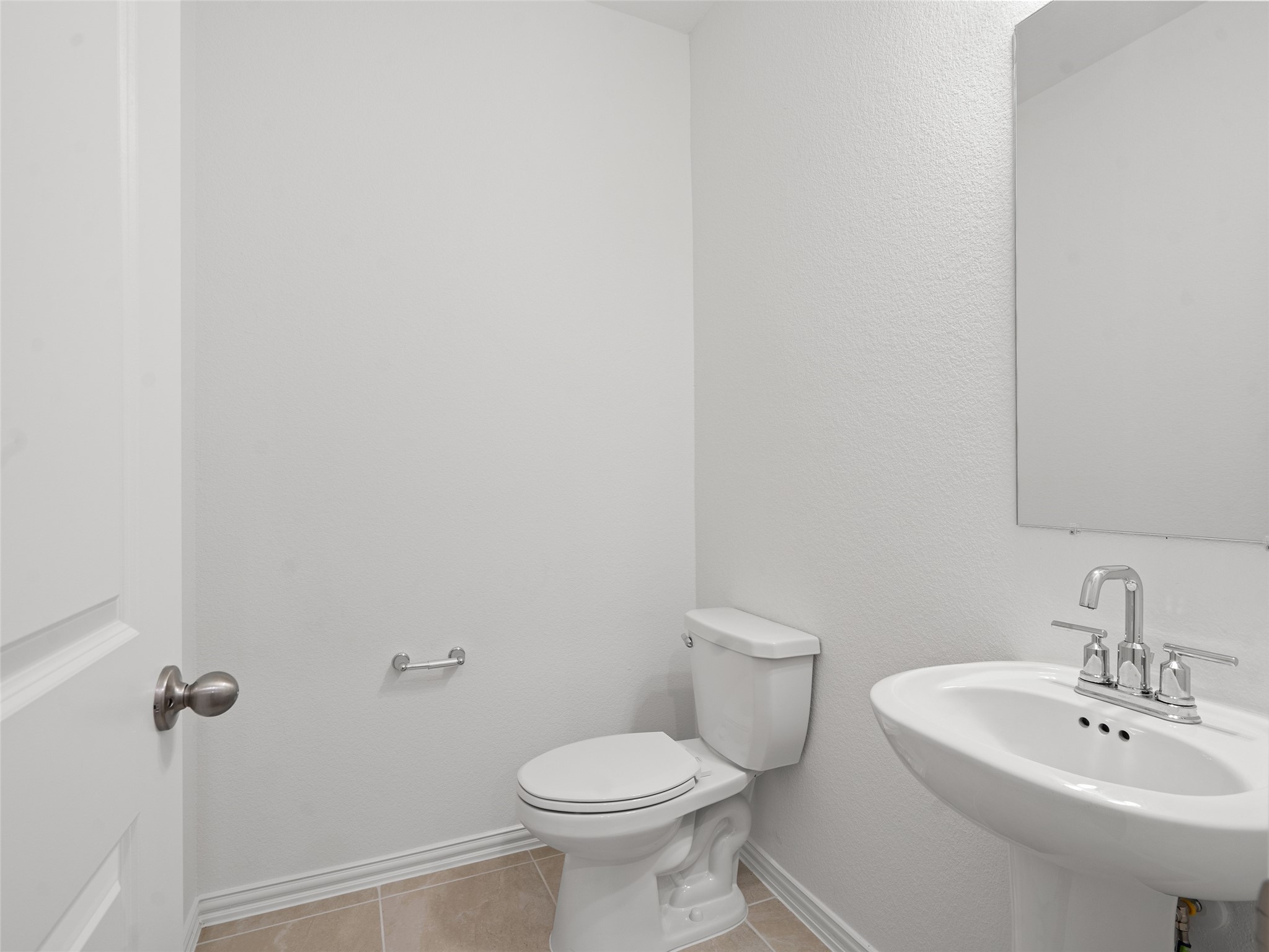 410 Strm Bnd Way Rosenberg, TX 77471 - Photo 25 of 39 a white toilet sitting next to a white sink
