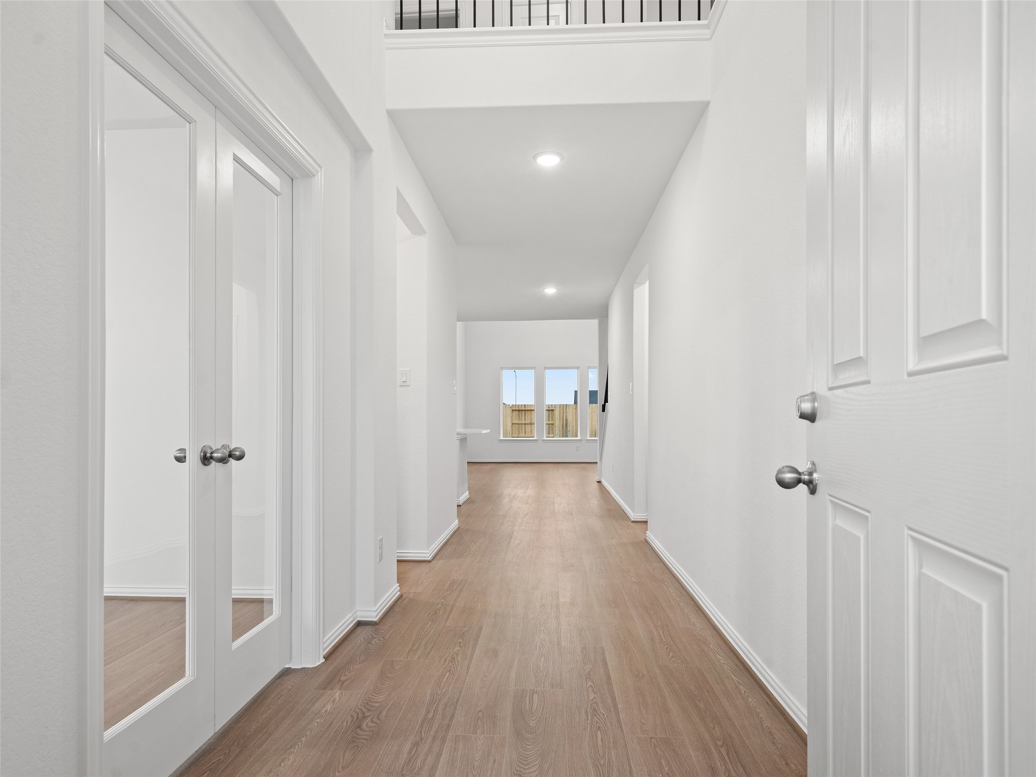 410 Strm Bnd Way Rosenberg, TX 77471 - Photo 5 of 39 a view of a hallway with wooden floor