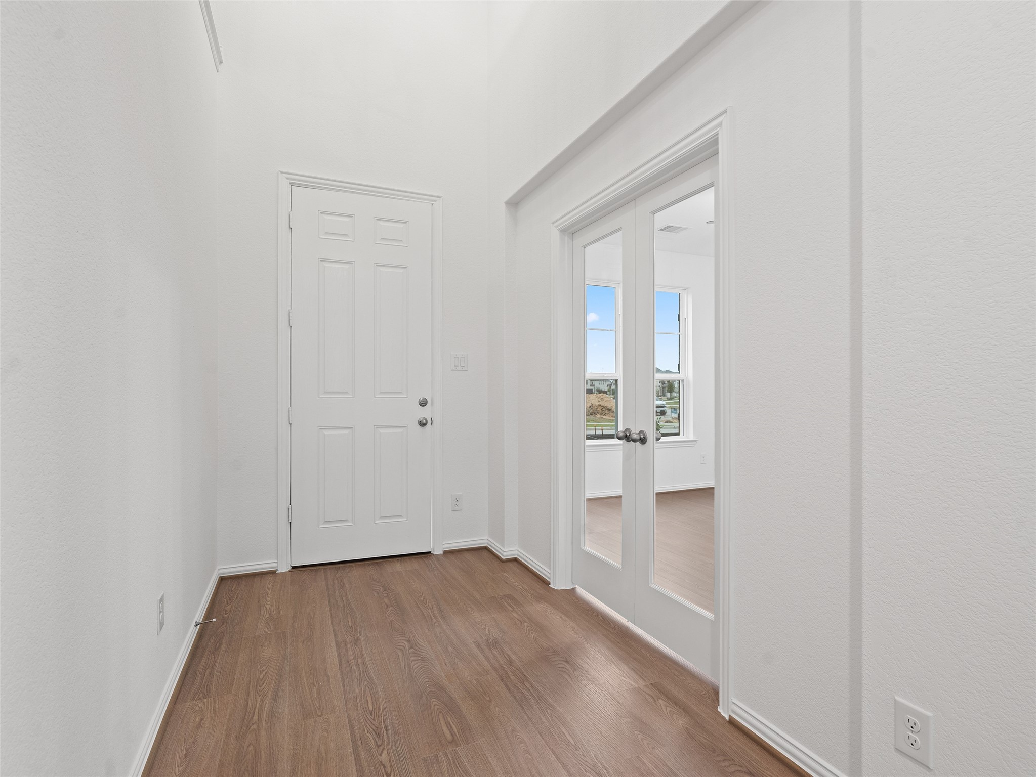 410 Strm Bnd Way Rosenberg, TX 77471 - Photo 6 of 39 a view of wooden floor in an empty room