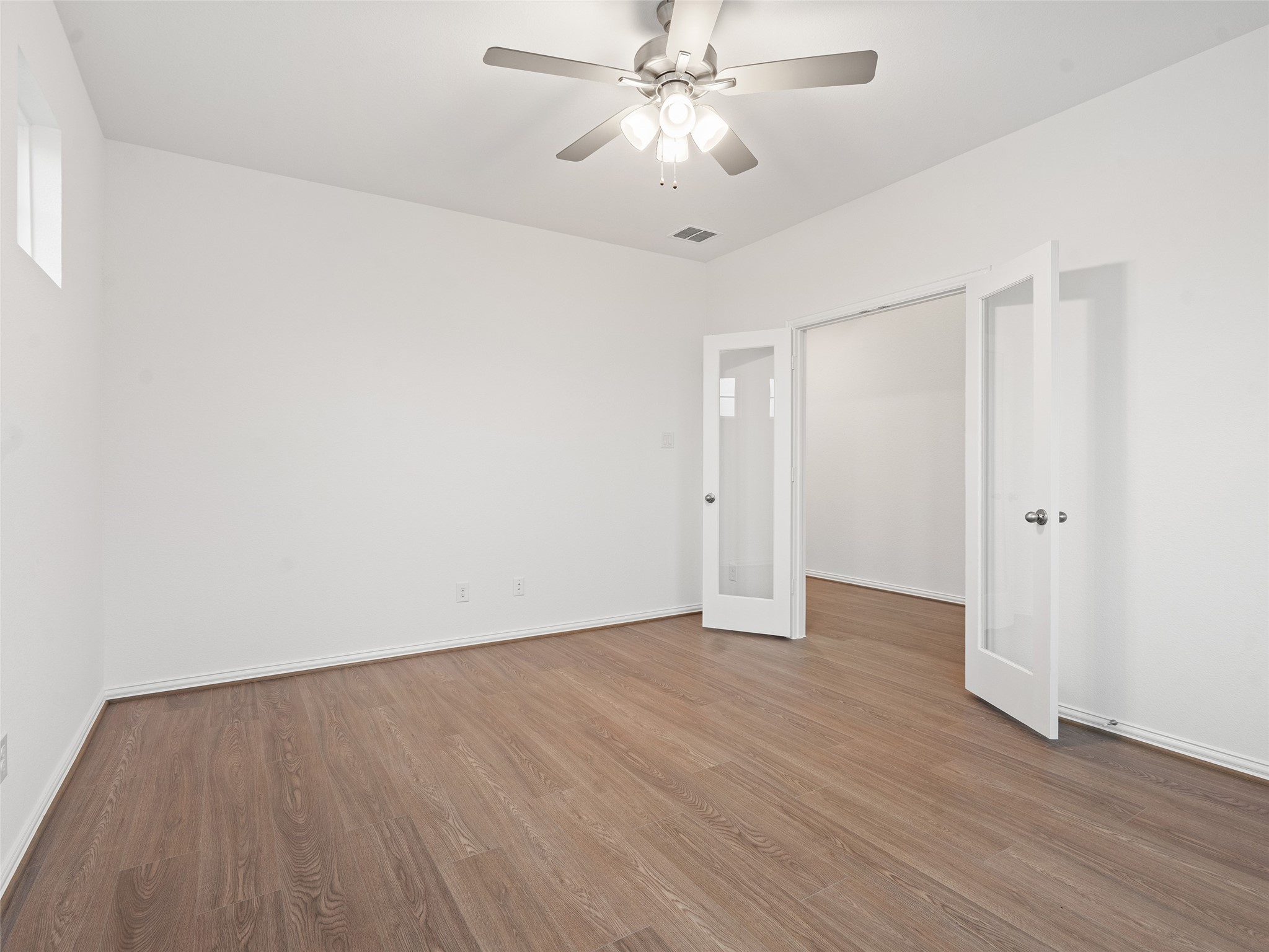 410 Strm Bnd Way Rosenberg, TX 77471 - Photo 8 of 39 a view of an empty room with wooden floor