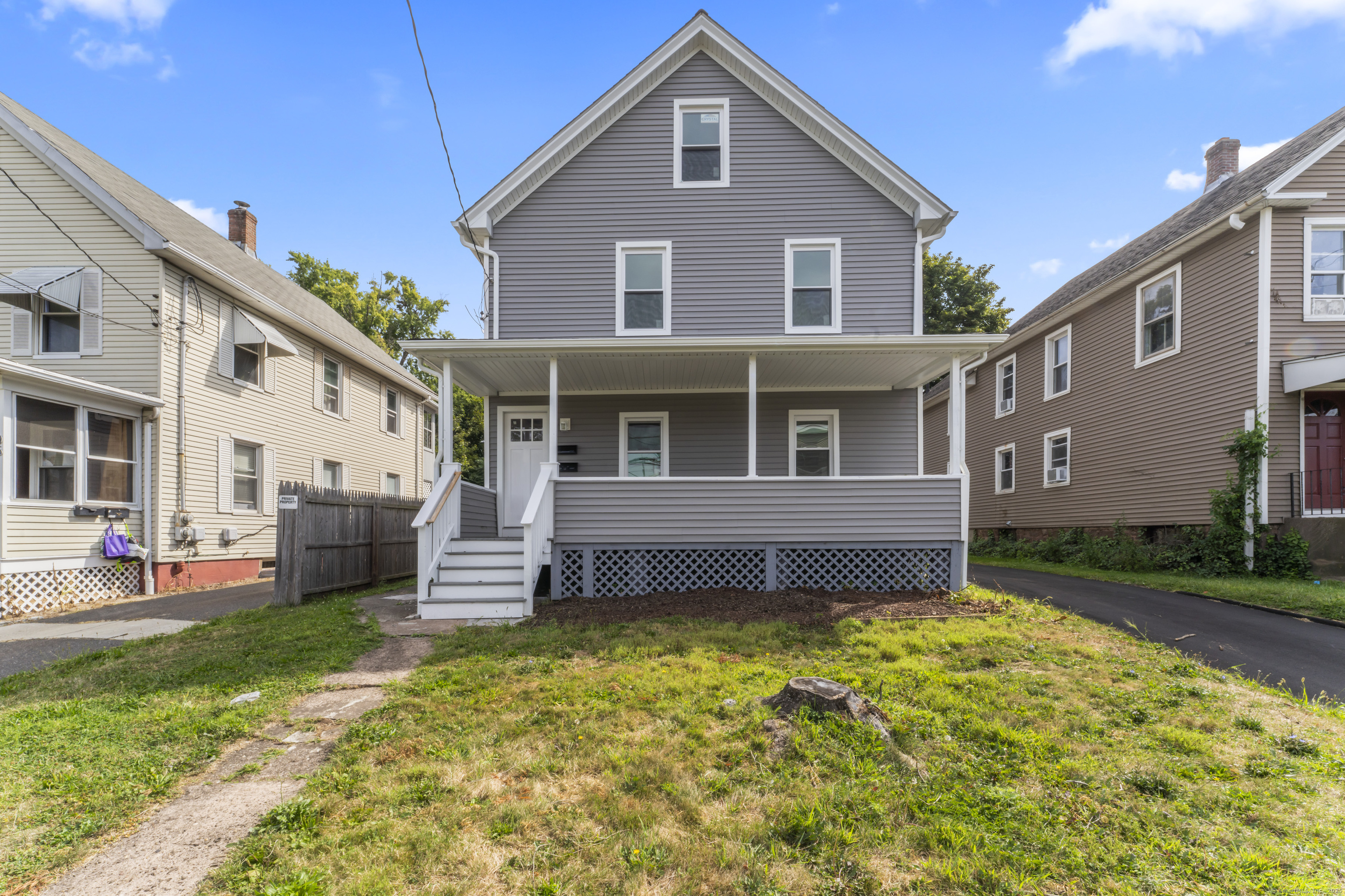 102 Main Street Extension Middletown, CT 06457 - Photo 1 of 1 a front view of a house with a garden