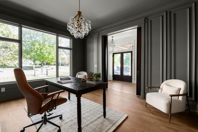 a living room with furniture a window and a fireplace