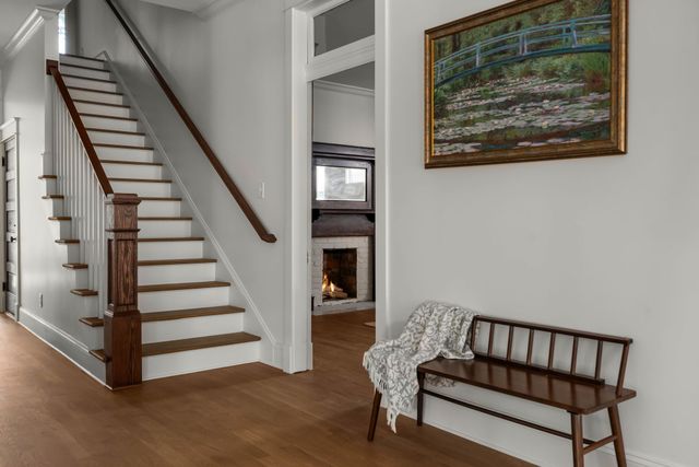 a kitchen with a sink cabinets and wooden floor
